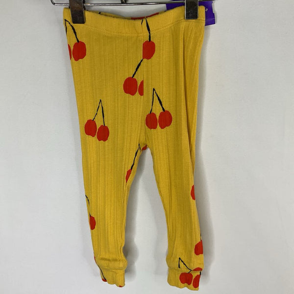 Size 6-12m: Mini Rodini Yellow/Red Cherries Ribbed Leggings