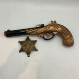 Toy Flintlock and Sheriff Badge